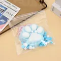 Detailed close-up of a 14cm giant blue and white plush cat paw squishy toy in clear plastic bag - Blue Flocking