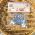 Detailed view of the blue transparent cat paw squishy toy in its cute retail packaging - Transparent Blue Cat Paw (With Stars Glitter)