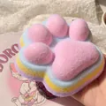 Detailed macro view of a colorful rainbow cat paw squishy toy with soft pink flocking texture - Four-Color Rainbow Pink