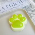 Macro view of a cute cat paw squishy toy featuring vibrant neon green jelly pads - 7cm / Muscat Green
