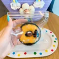 Detailed close-up of a Halloween themed doughnut squishy toy in its clear zip packaging - 8x8cm / Halloween Bitten Donut