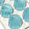 Detailed view of the translucent light blue glacier Canelé squishy toy for stress relief - Glacier Canelé Squishy