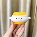 Detailed macro view of yellow and white cartoon puppy squishy stress relief toy texture - Coin Dog Squishy