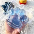 Macro view of translucent blue cat paw squishy toy in clear packaging bag - Jumbo Cat Paw / 220g/Pack / Transparent Blue