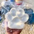 Close-up of jumbo cat paw squishy toy made of soft TPR material in a clear bag - Jumbo Cat Paw / 220g/Pack / Clear White