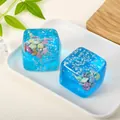 Detailed macro view of blue ocean-themed cube squishy toy with shells and star sequins - 5cm / Blue Shell
