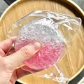 Close-up of pink and clear DIY ice-crushed filler for sensory squeeze toys - 6cm / Pink