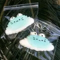 Detail showing cute cat-faced croissant squishy toys individually packed in clear plastic bags - Croissant Style (Sea Salt Blue)