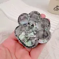 Giant glittery cat paw shaped squishy toy made of TPR material for effective stress relief - Aurora Silver