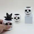 Macro detail of Halloween skull squeeze toy with pop-up black bat for stress relief - Non-Glowing Skull Cup