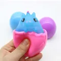 Blue animal surprise popping out of pink squeeze cup stress relief fidget toy for kids - Unicorn Squeeze Cup Squishy