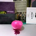 Pink translucent slushy apple-shaped squishy stress relief toy with a soft textured finish - Slushy Apple / Pink