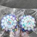 Detail of simulation taro cake squishy toy with colorful sprinkles in clear packaging - Taro Cake Shape / Purple + White