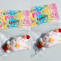Detail view of a cute white hamster pinch toy inside colorful PINCH family packaging. - Deluxe Pack With Card Header / White