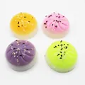 Set of 4 colorful yolk pastry squishy toys in yellow pink purple green for stress relief - Colorful Sesame Bun Squishies