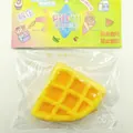 Soft waffle shaped squishy decompression toy in yellow with orange jam detail - Fried Triangle Waffle Squishies