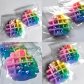 Detailed view of colorful rainbow waffle squeeze toy in clear plastic packaging bags - Colorful Waffle Style / Iridescent