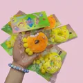 Simuliertes Donut-Squeeze-Spielzeug in Gelb und Orange, weiches Anti-Stress-Squishy-Spielzeug - Hardcover Zufällige Farbe / Glitzer Donut Stil
