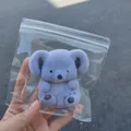 Cute purple flocked koala squishy toy for stress relief, shown in plastic packaging. - Purple Koala / 9*9
