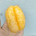 Realistic orange Daifuku squishy toy with coconut shavings texture for stress relief. - 100 Units Pack / Fried Yellow