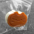 Jouet anti-stress spongieux en forme de chat orange dans un emballage transparent - Chat au Fromage Café / Beige et Café
