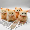 Primer plano de cuatro figuras de gato naranja y blanco para apretar sobre revistas - Paquete de 135g / Gato Agachado Naranja