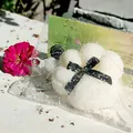 White UV-sensitive cat claw squishy toy with decorative black bow in packaging - Coconut Shred Cat Paw Squishies / White