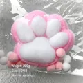 Macro view of a soft pink plush cat paw squishy toy in plastic packaging - Large Style (Jumbo) / 12x11cm