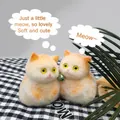 Detailed close-up of two adorable fuzzy orange cat squishies for stress relief toys. - 74g Pack / Orange Squatting Cat
