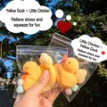 Detailed view of simulation yellow duck and chick squeeze toys in clear plastic zip-lock bags - Little Yellow Duck & Mini Chick Set