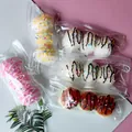 Vue détaillée de jouets spongieux Takoyaki triples dans des sacs d'emballage clairs - Squishy Takoyaki peint