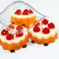 Detailed macro shot of strawberry tart silicone squishy toy with colorful sprinkles - Strawberry Egg Tart Style