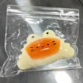 Frosch-Croissant Squishy Spielzeug zum Stressabbau in Klarsichtbeutel - Karamell-Croissant-Squishy