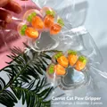 Macro view of a transparent cat paw squishy toy featuring tiny carrot accents inside. - Carrot Style / 60g Pack / Transparent Orange