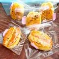 Jouet anti-stress mou en forme de beignet frit dans un sac zippé avec clip rose - Squishy Bâton de Pâte Frit Doré