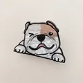 Detailed close-up of a bulldog hair claw clip with pearlescent finish and cute expression. - Bulldog