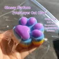 Close-up of a colorful rainbow cat paw squishy toy for stress relief in a clear bag. - 7cm Four-Layered Color Cat Paw Squishy (Glossy)