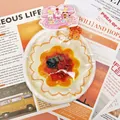 Close-up of a food-grade silicone egg tart squishy toy with unique stitched edge - Strawberry Egg Tart