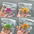 Set of four transparent cat paw squishy toys featuring fruit and vegetable patterns - 60g Pack / Transparent Cherry