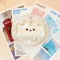 Detailed view of a cute rabbit-shaped squishy toy in decorative lace packaging - White