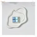 Detailed macro view of a 4-key mechanical switch fidget toy with blue and teal keycaps - Sea Salt Milky Green (White Base)