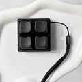 Top-down detail of 4-key fidget switch keychain with matte black cat ear keycaps - Pure Dark Chocolate
