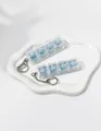 Detail view of 4-key mechanical switch fidget keychains in standard and cat-ear styles - Blue