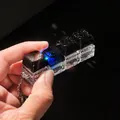 Close-up of 4-key galaxy mechanical keyboard fidget toy keychain with glowing LEDs - 4-Key Style / No Light / Black