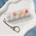 4-key mechanical switch tester keychain fidget toy in clear case for stress relief - Pomelo Orange
