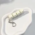 Minimalist creamy white 4-key mechanical switch tester fidget toy keychain with clear base - 4-Key Layout / Light Yellow