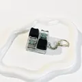 Macro view of tactile switches and cat-shaped keycaps on a fidget toy keychain - 4-Key Layout (Crispy Tactile Sound) / Cyber Black