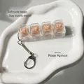 Stress-relief 4-key mechanical keyboard switch tester keychain in rose champagne - Light Pink