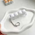 Mechanische 4-toets schakelaar fidget toy sleutelhanger voor ontspanning en stressvermindering - 4 Haken / Wit Gestoomd Broodje