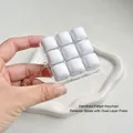 Weißes 3x3 mechanisches Switch-Fidget-Spielzeug mit Schlüsselanhänger zur Entspannung - 9-Gitter Brötchen Stil
